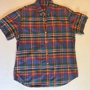Red, blue and green madra shirt with button down collar and buttons in front.